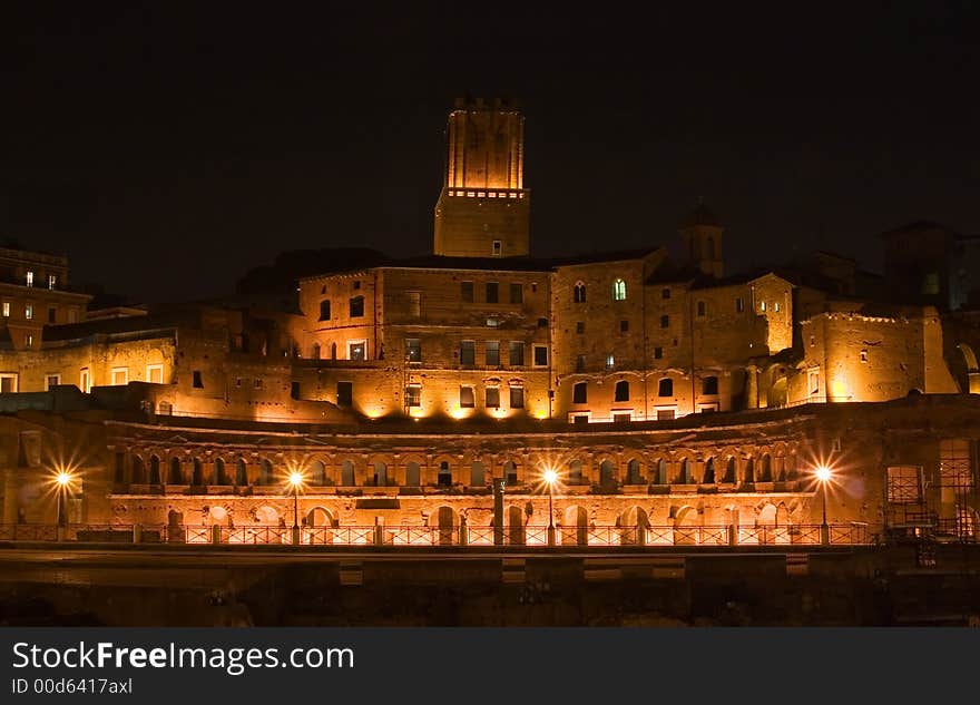 Red stone building - Trajan forum in Rome, Italy by night