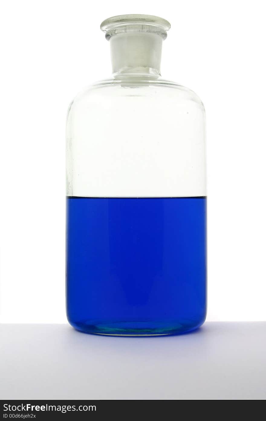 Laboratory bottle with blue liguid on the white background. Laboratory bottle with blue liguid on the white background