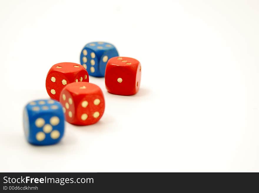 Blue and red dice on a white table. Blue and red dice on a white table