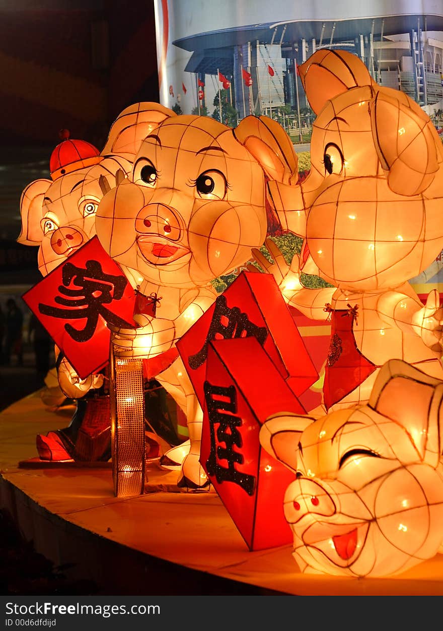 Ornamental lamp with pig shape design for Chinese new year of pig;The Chinese characters greeting means family and home rich. Ornamental lamp with pig shape design for Chinese new year of pig;The Chinese characters greeting means family and home rich.