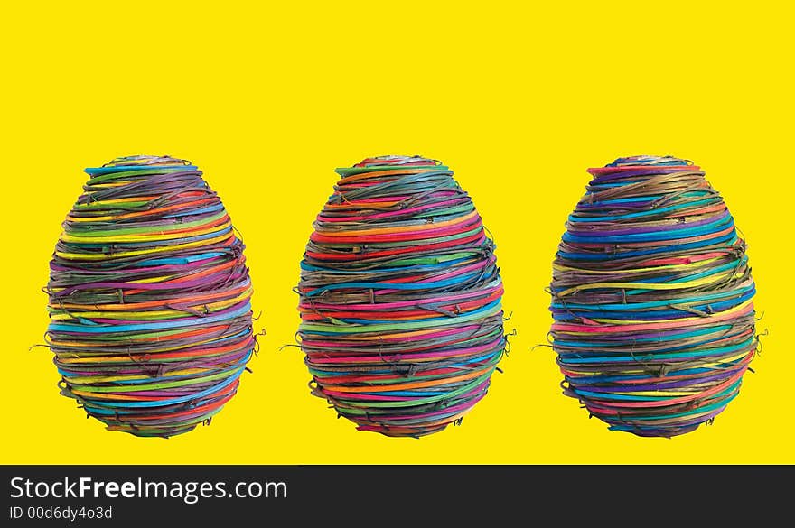 Three eggs on yellow background