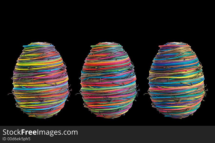 Three eggs on black background