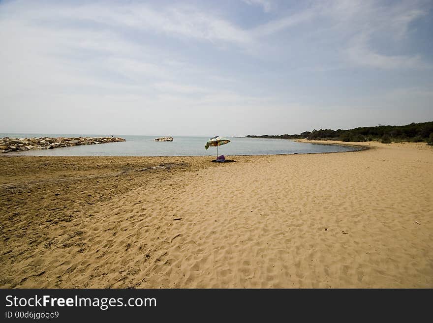 Lonely umbrella on the beach