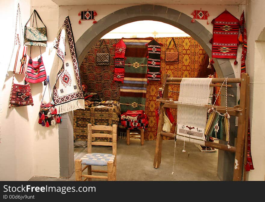 The workplace of a Syrian weaver producing tapestries and handbags. The workplace of a Syrian weaver producing tapestries and handbags.