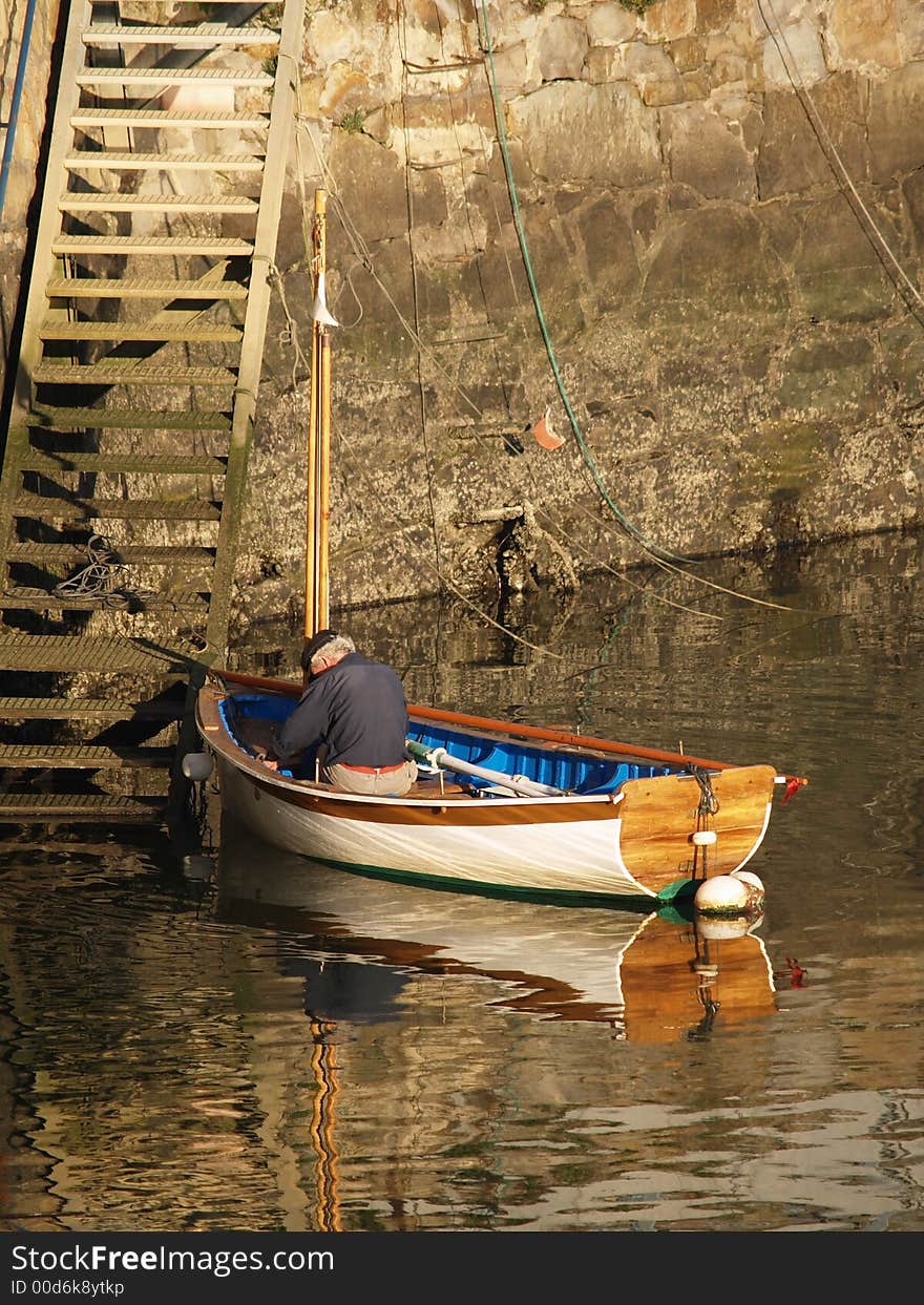 Lonely fisherman in a boat