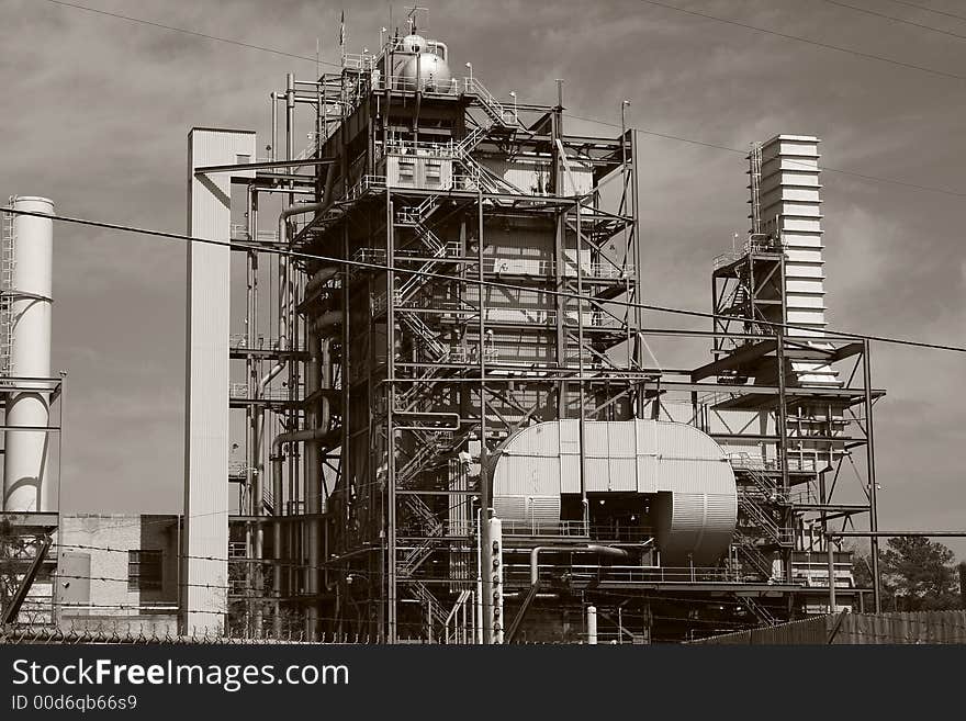 Bleak, black & white image of a 1950's era oil-fired electrical power plant. Bleak, black & white image of a 1950's era oil-fired electrical power plant.