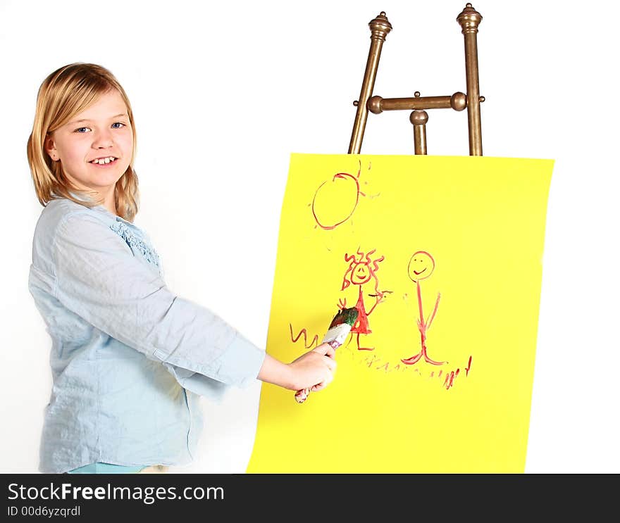 Pretty young girl painting on an antique easel. Pretty young girl painting on an antique easel