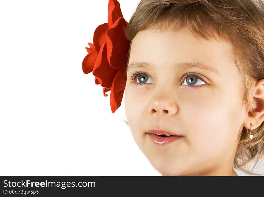 Little smiling girl with red rouses in the hair. Little smiling girl with red rouses in the hair