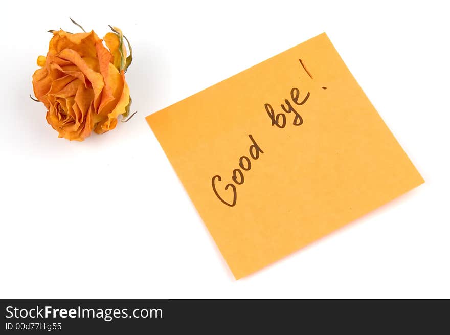 Orange note paper with inscription good bye and rose bud isolated over white