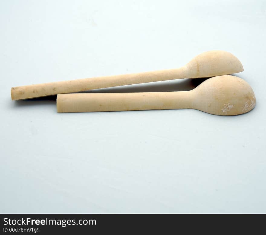 Two wooden spoon on a white background. Two wooden spoon on a white background