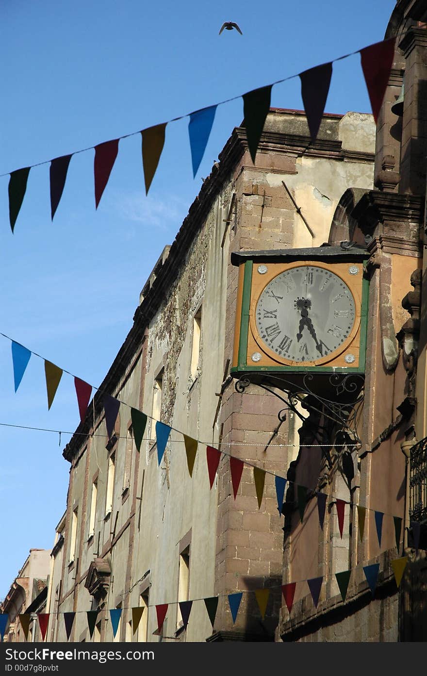 Bird flying on ancient clock under blue sky. Bird flying on ancient clock under blue sky