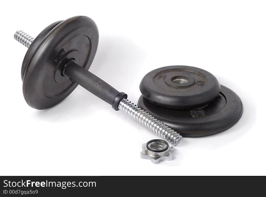 Partially disassembled black rubber dumbbell over white background. Partially disassembled black rubber dumbbell over white background