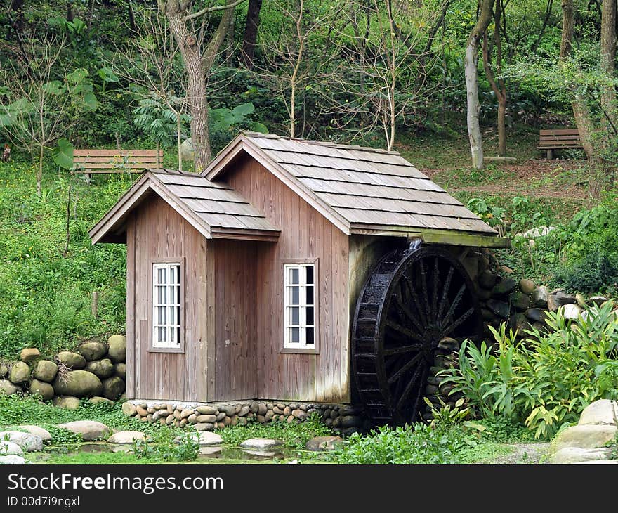 Water mill in the park. Water mill in the park.