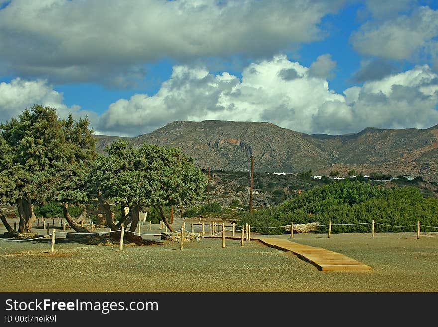 Photo of sandy beach and mountains on south of Crete (Greece). Photo of sandy beach and mountains on south of Crete (Greece).