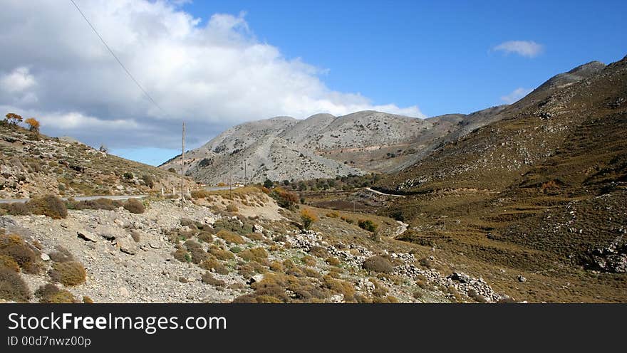 Rocky mountains on Crete (Greece). Road and telegraph line. Rocky mountains on Crete (Greece). Road and telegraph line.