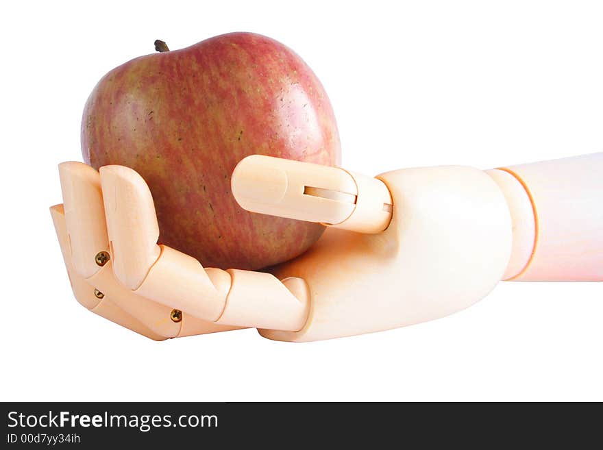 Wooden hand holding an apple