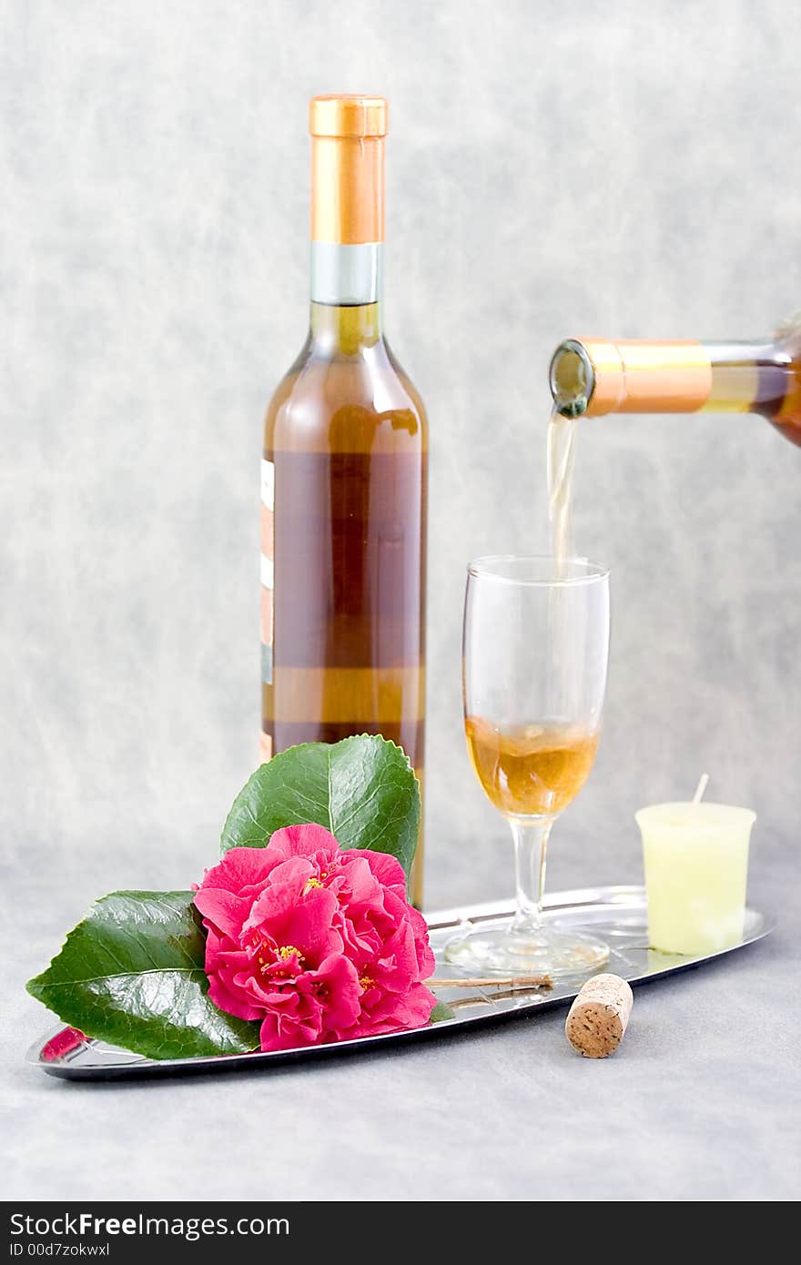 Her favorite wine, a beautiful camillia from the garden, add a candle and wine glass, she is all set. Her favorite wine, a beautiful camillia from the garden, add a candle and wine glass, she is all set.