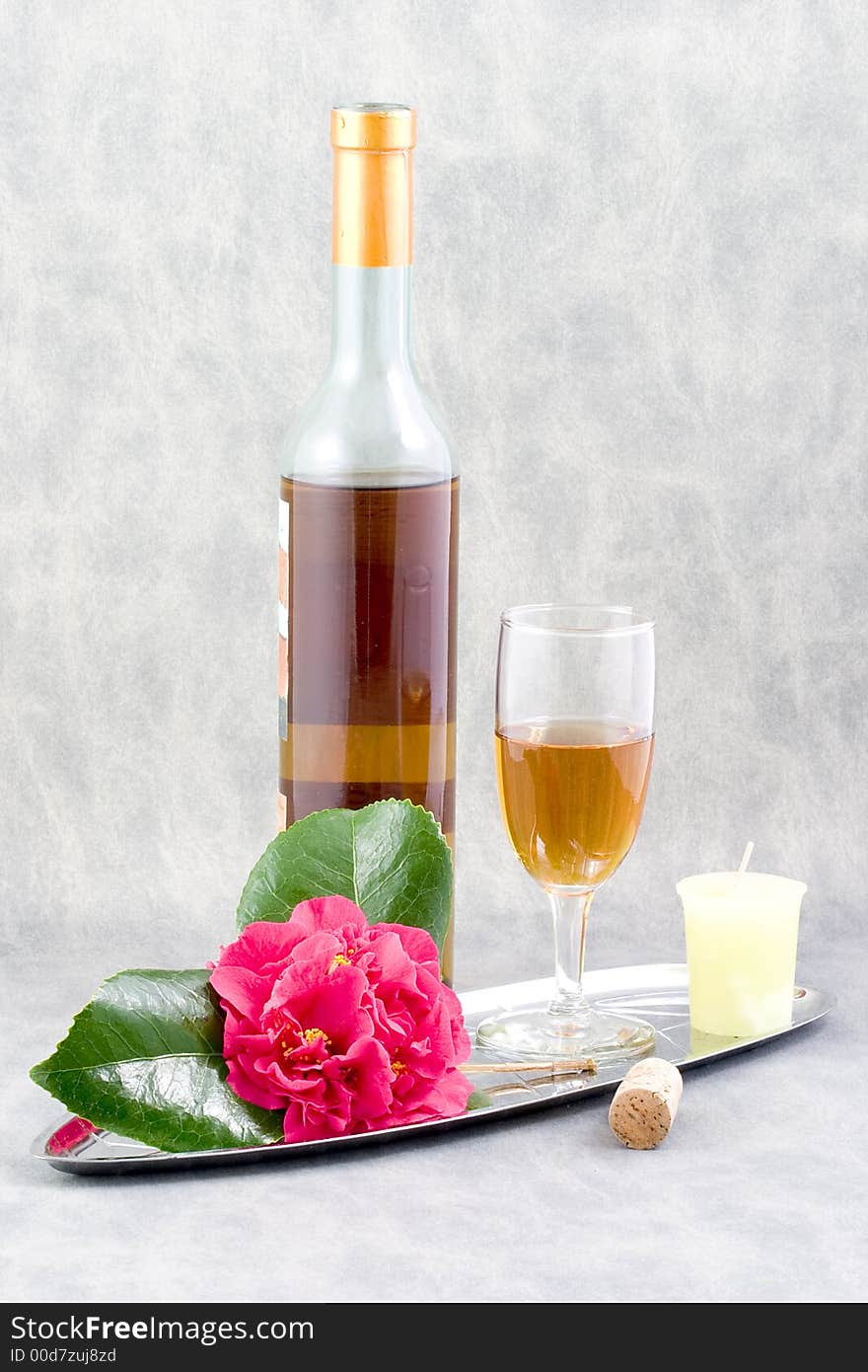 Her favorite wine, a beautiful camillia from the garden, add a candle and wine glass, she is all set. Her favorite wine, a beautiful camillia from the garden, add a candle and wine glass, she is all set.