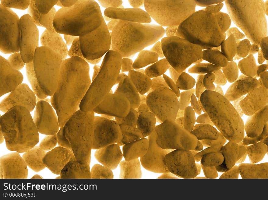 Golden background of a painted gravel. Golden background of a painted gravel