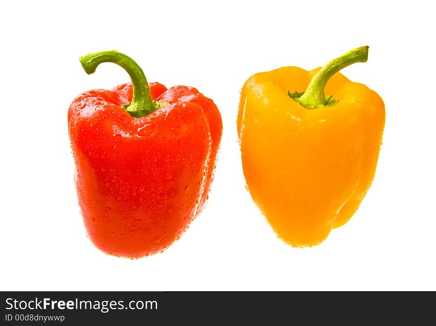 Red and Yellow Peppers the Covered Drops of Water. Isolated On White. Close-up. Red and Yellow Peppers the Covered Drops of Water. Isolated On White. Close-up