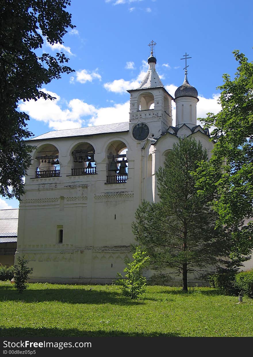 Summer view of Bell-tower with clock in Saviour-Euvfimiev Monastery in Suzdal. (Suzdal, Vladimir region, Golden Ring of Russia). Summer view of Bell-tower with clock in Saviour-Euvfimiev Monastery in Suzdal. (Suzdal, Vladimir region, Golden Ring of Russia)