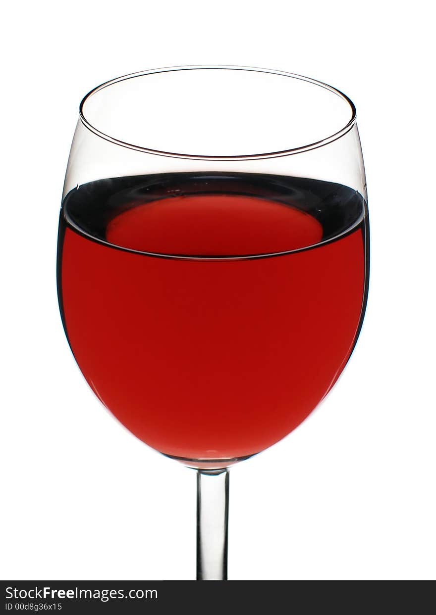 Glass of red wine close-up isolated over white background