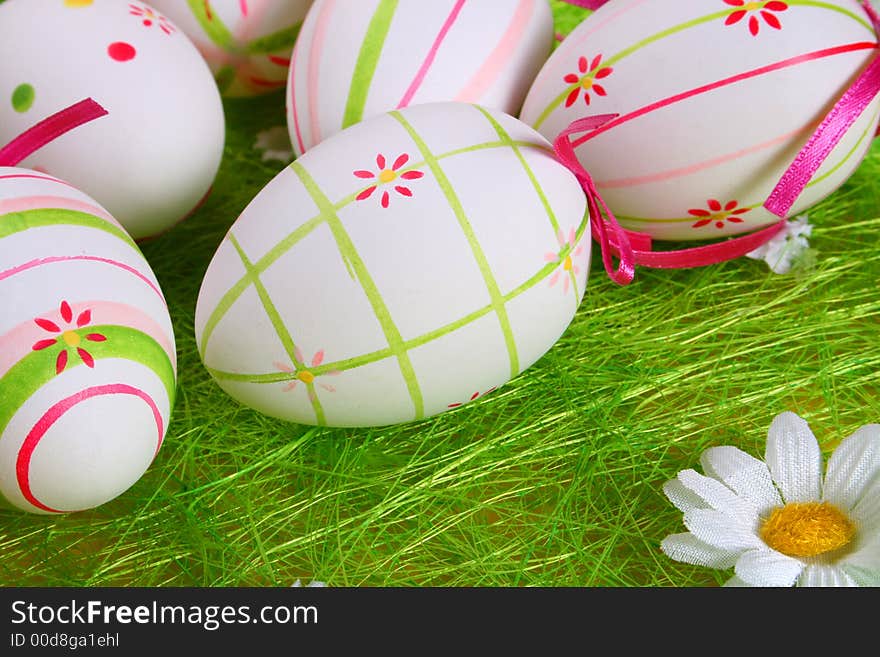 Closeup of several Easter eggs over green grass. Closeup of several Easter eggs over green grass.