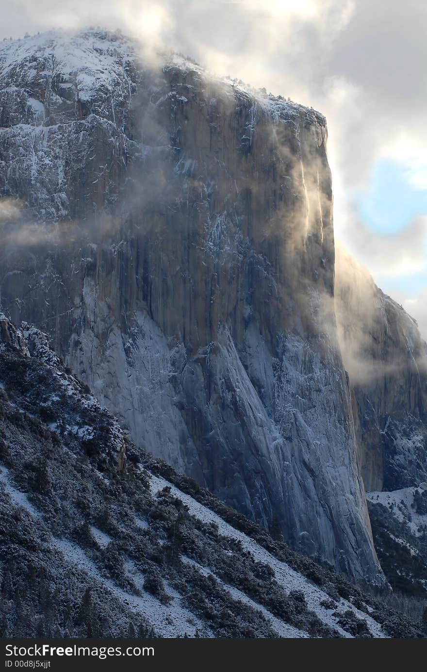 El Capitan illuminated by early morning stormy and misty skies. El Capitan illuminated by early morning stormy and misty skies