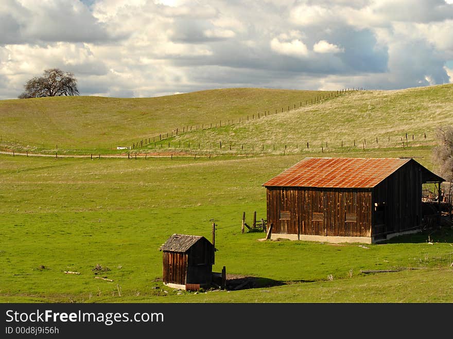 A Lone Barn And Shed On A California Hillside