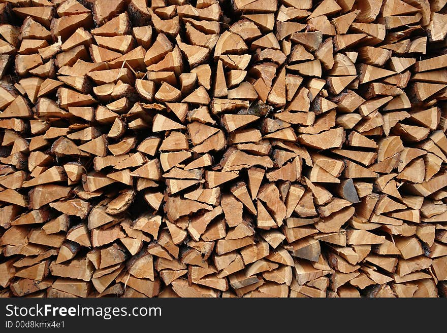 A pile of wooden logs laid together