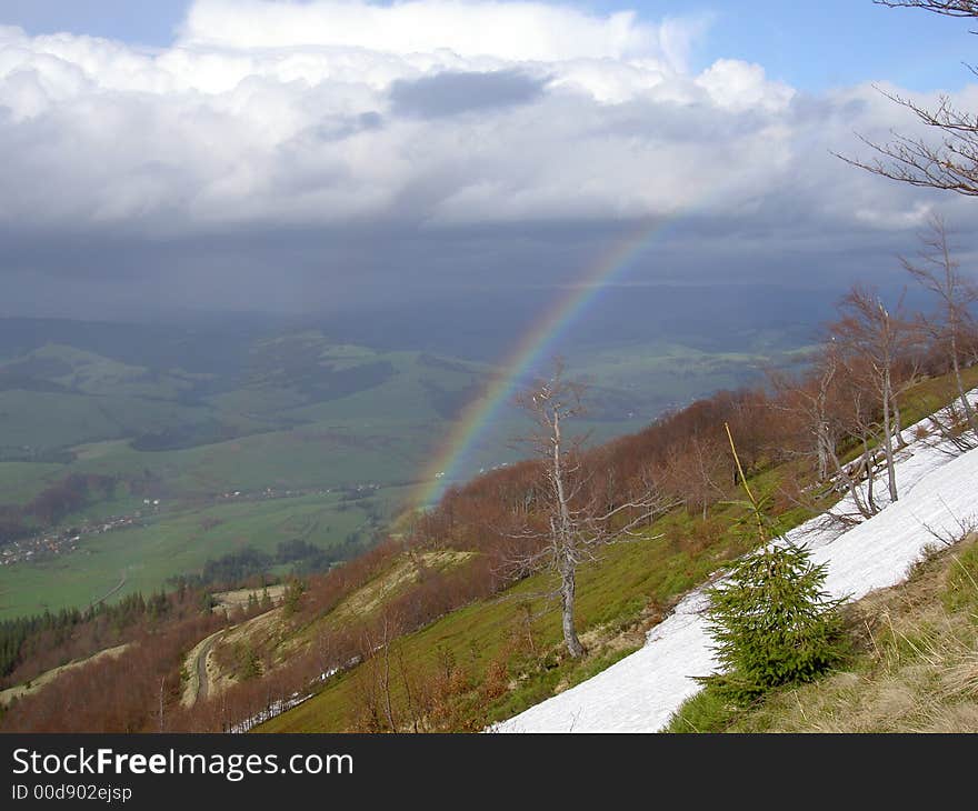 Rainbow on height of bird flight in the mountains of Carpathians. Rainbow on height of bird flight in the mountains of Carpathians