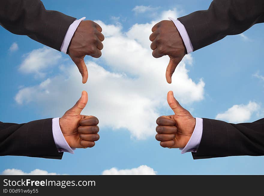 This is an image some hands competing against each other with a sky in the background.This image can be used to represent the theme Team Decisions