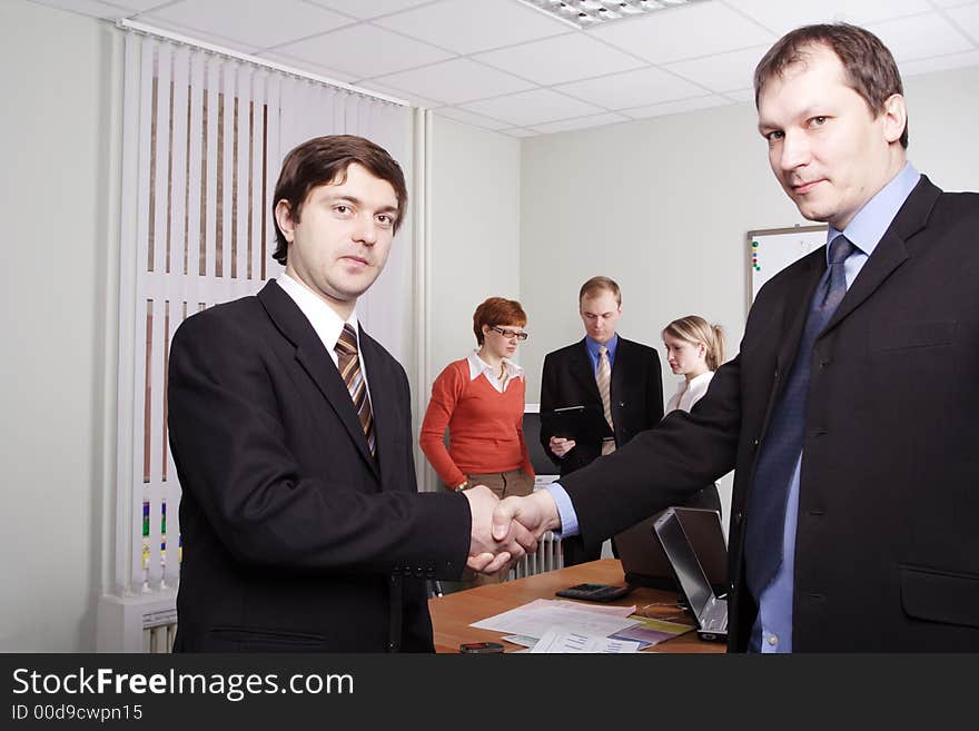 Group of business people working together in the office. Group of business people working together in the office.