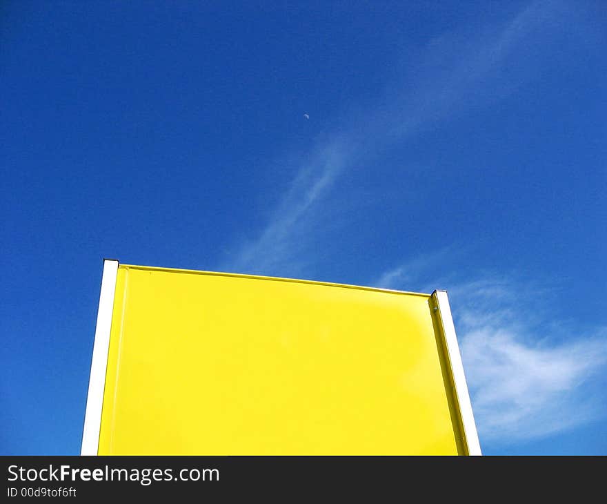 Yellow blank billboard and blue sky