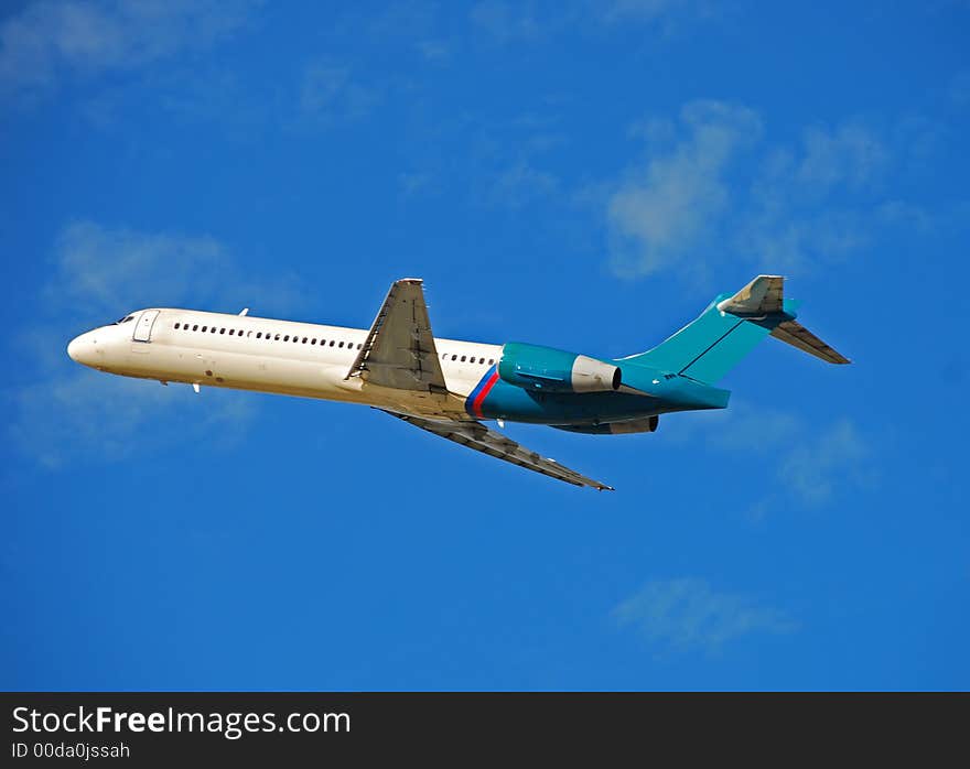 Side view of Boeing 717 jet taking off