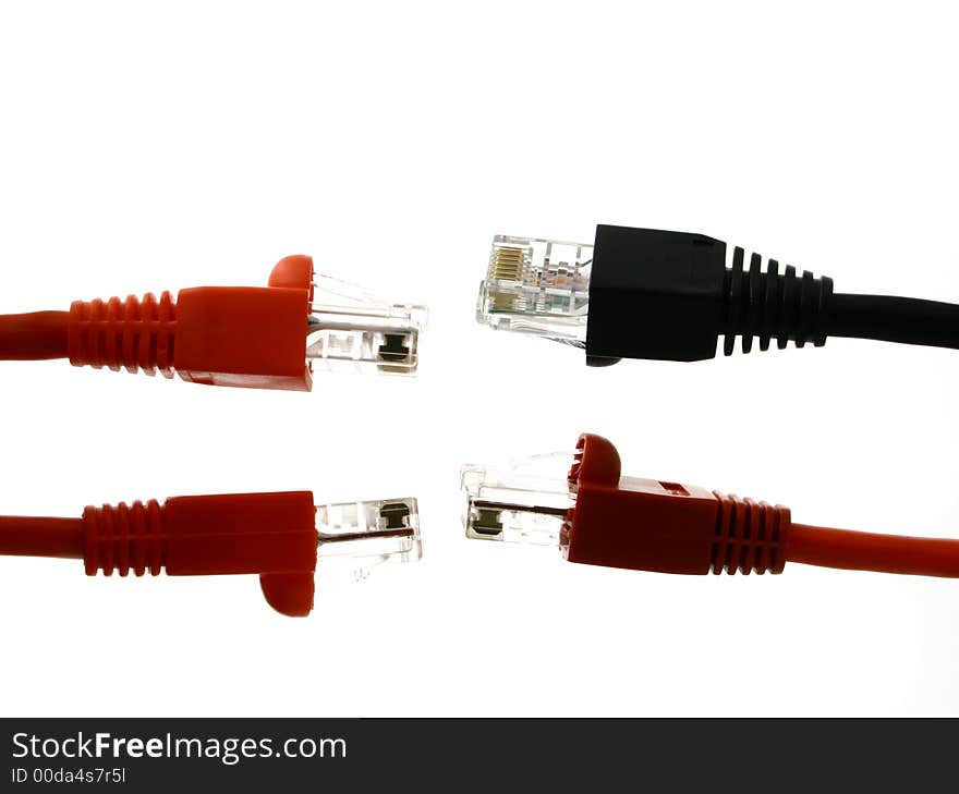 Couples of red and black RJ45 endings against each other on the white back ground. Couples of red and black RJ45 endings against each other on the white back ground