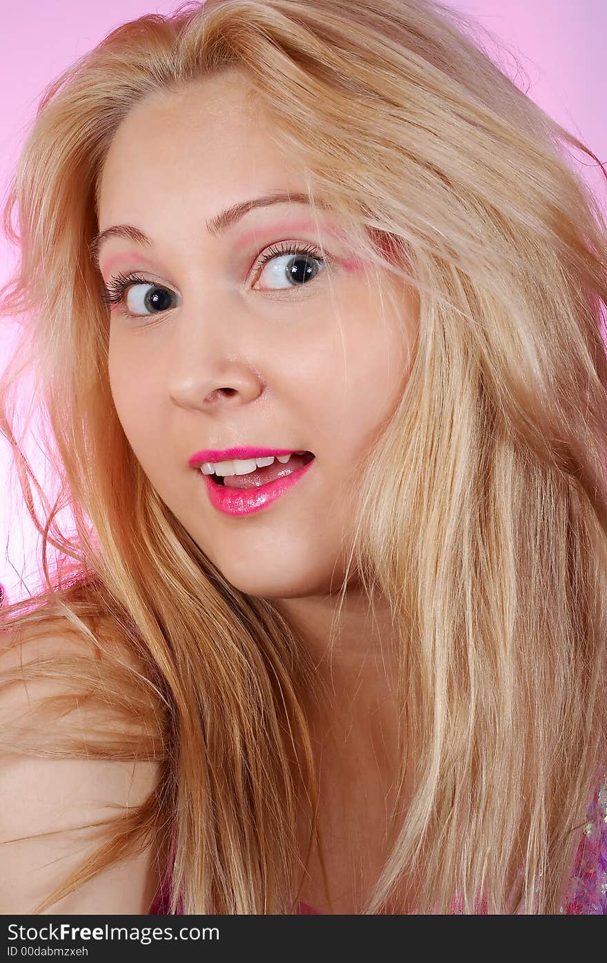 Amazed girl with pink make-up