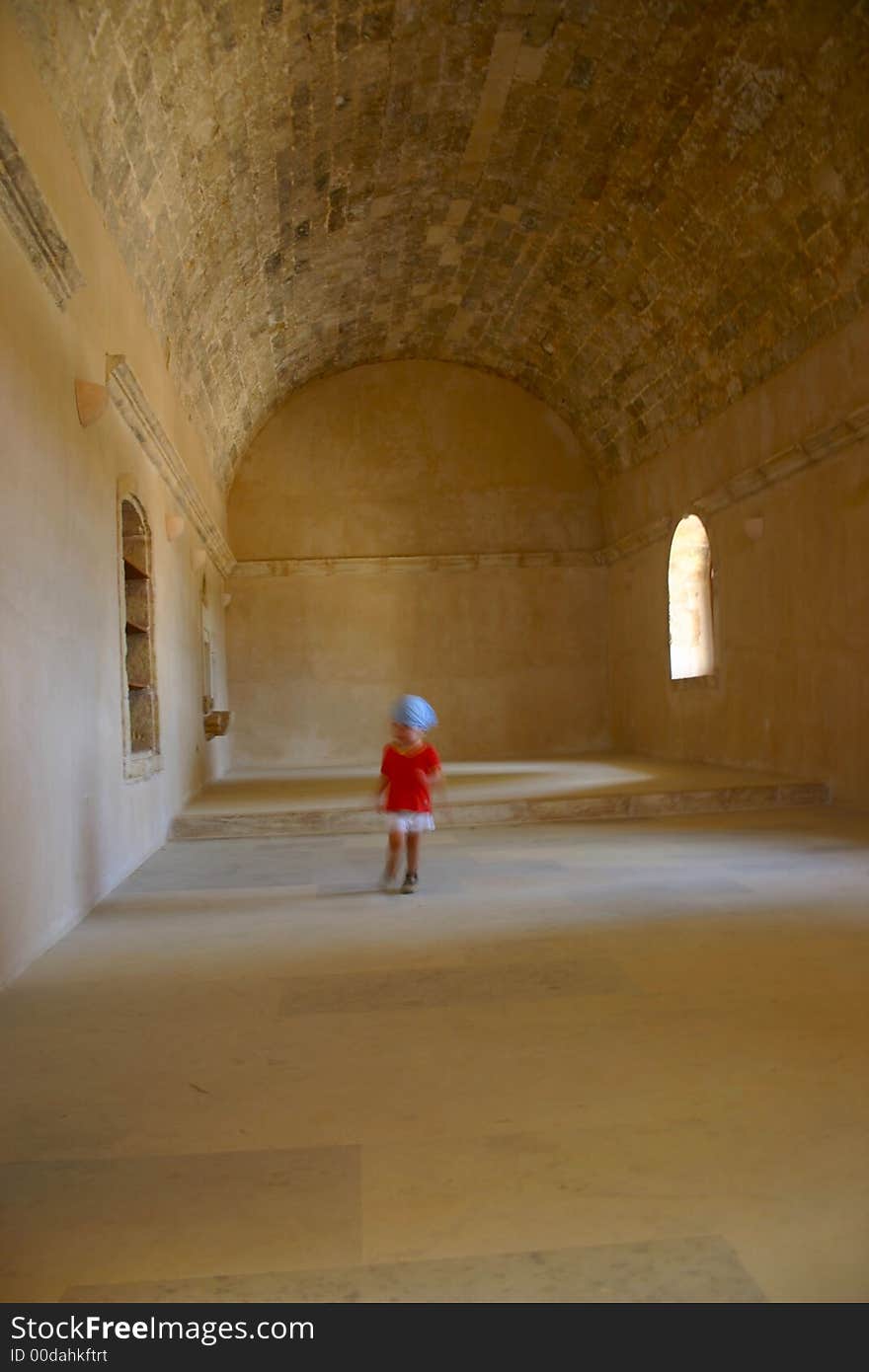 Child dancing in the ancient hall. Child dancing in the ancient hall