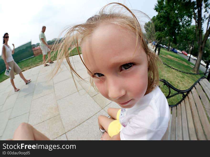 Little girl sitting on a bench near White House. Washington DC, USA. Little girl sitting on a bench near White House. Washington DC, USA