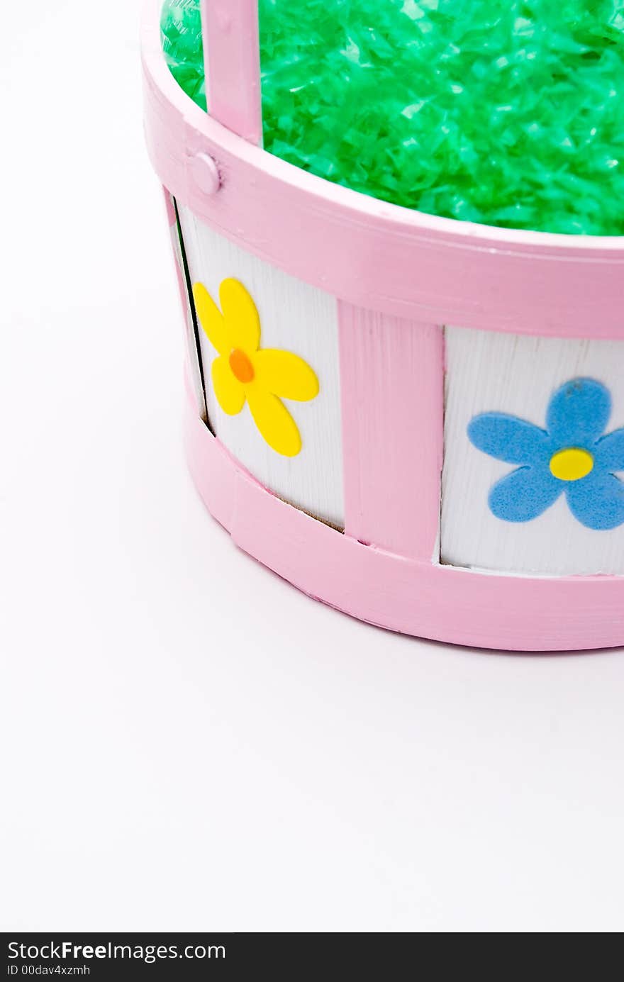 Easter basket filled with artificial grass with space for text