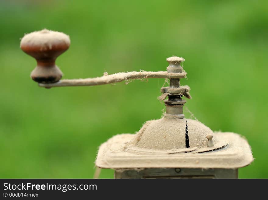 Old coffee grinder with dust