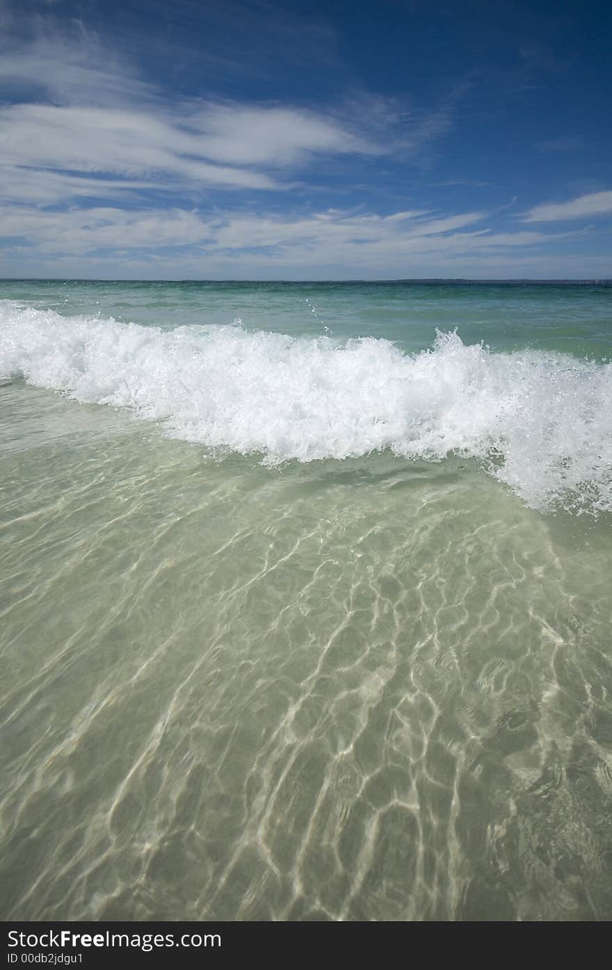 Closeup view of waves crashing on a tropical beach. Closeup view of waves crashing on a tropical beach