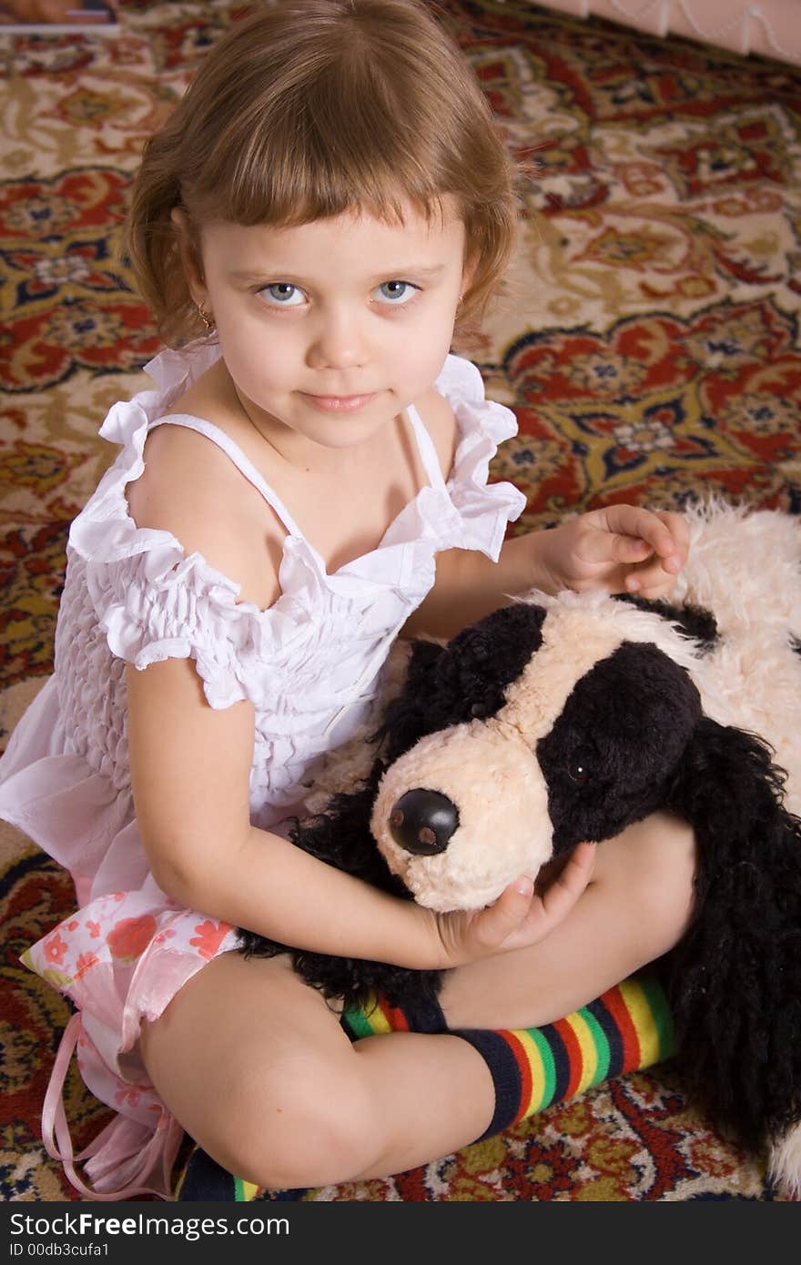 Little girl with toy dog