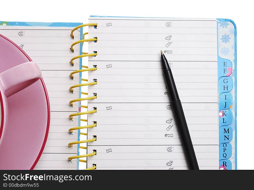 Cup of coffee with organizer and Pen