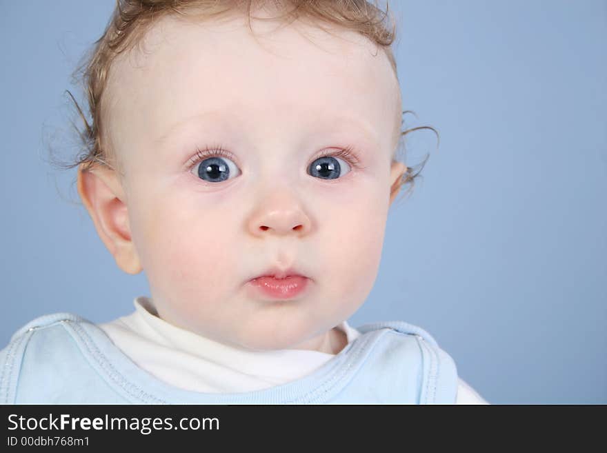 Baby portrait on the blue background