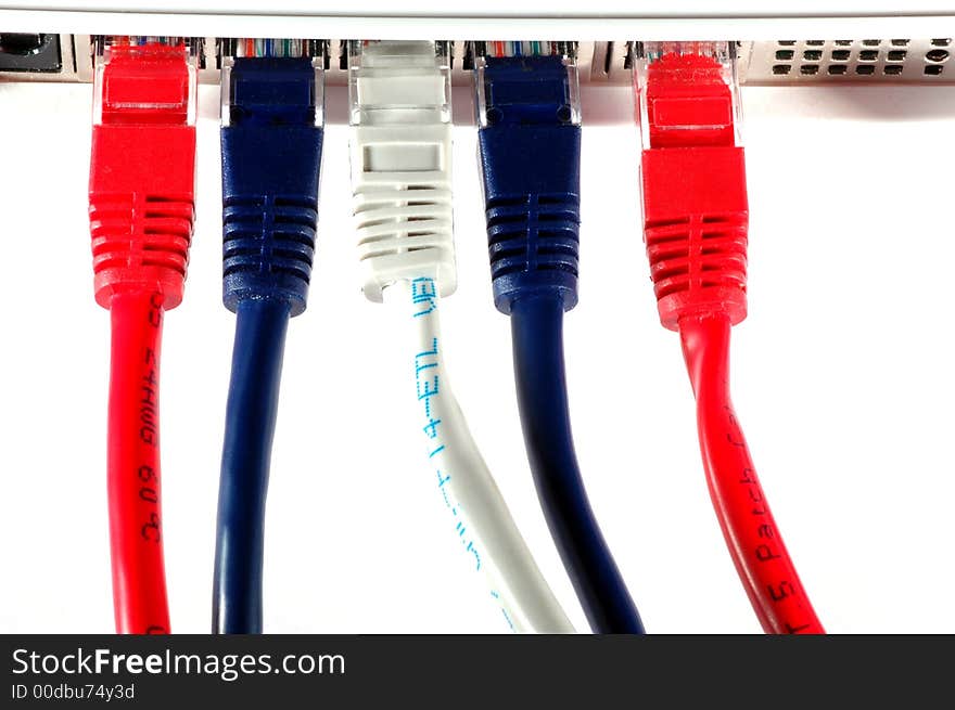 Network cable in three diferent colors in a router. Network cable in three diferent colors in a router