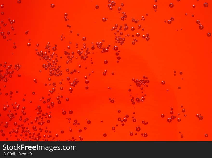 Sparkling Bubbles in an orange liquid