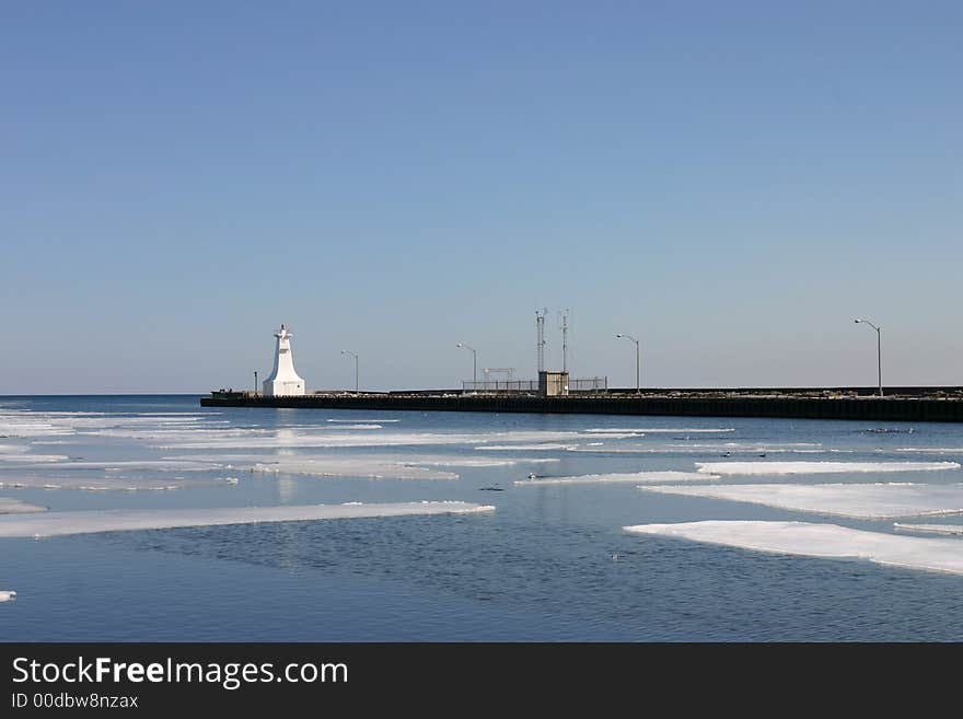 Sheets of ice melt in the harbour. Sheets of ice melt in the harbour