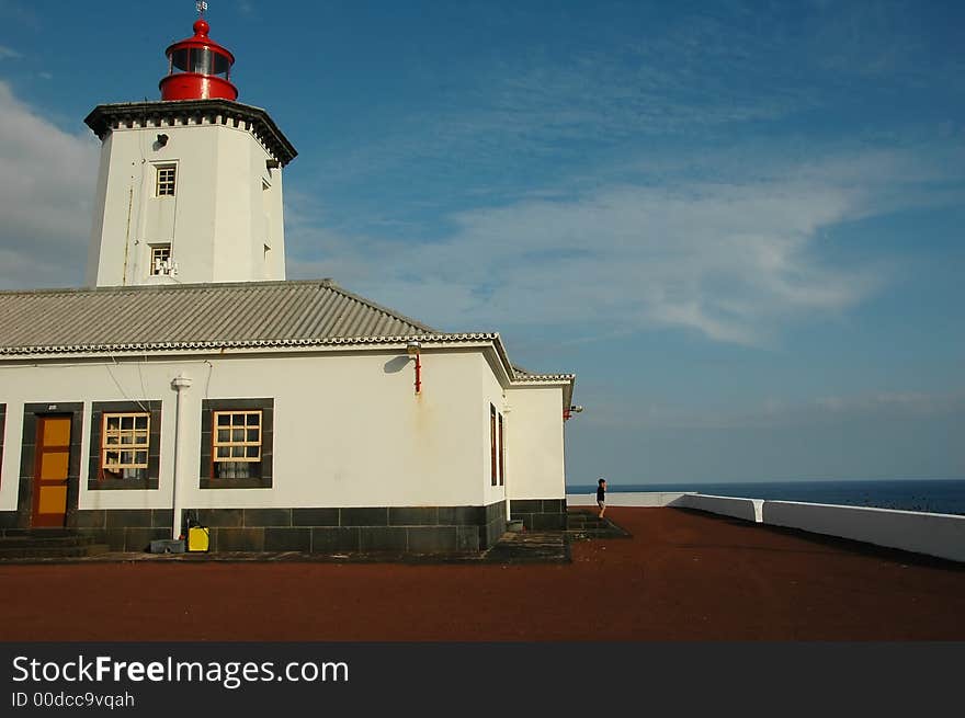 Lighthouse from the island in the Azores against a blue sky. Lighthouse from the island in the Azores against a blue sky