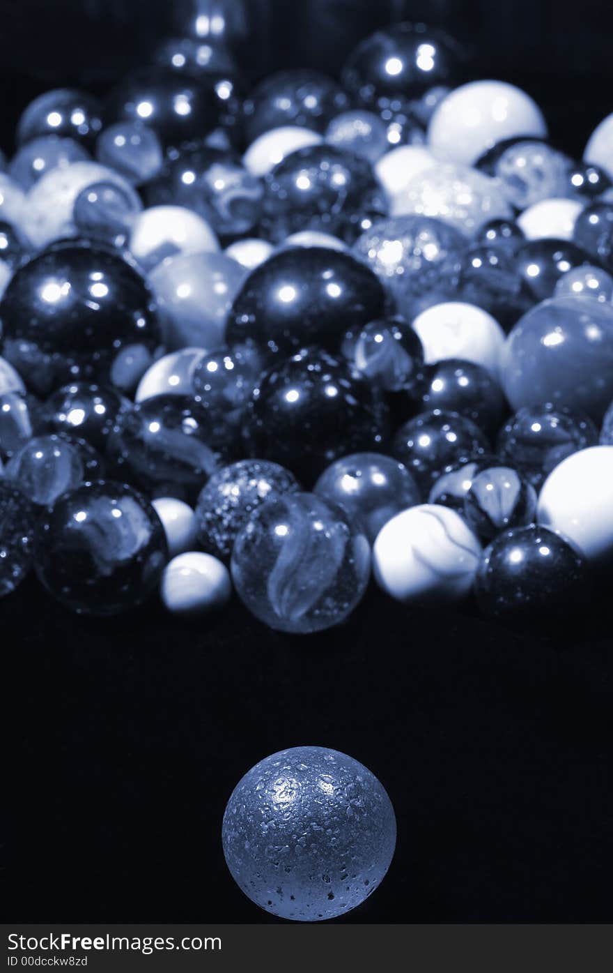 Different glass-balls in all sizes, suitable as backgrounds and designs, with diminishing perspective and blurry mirror effect, all in a blue toning, planet-idea. Different glass-balls in all sizes, suitable as backgrounds and designs, with diminishing perspective and blurry mirror effect, all in a blue toning, planet-idea